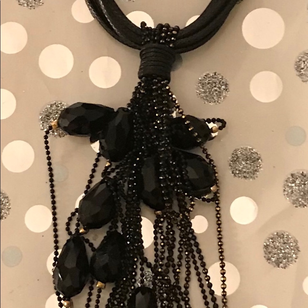 Leather strapped necklace with beaded tassels